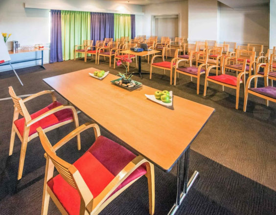 Chairs in function room and fruit on table