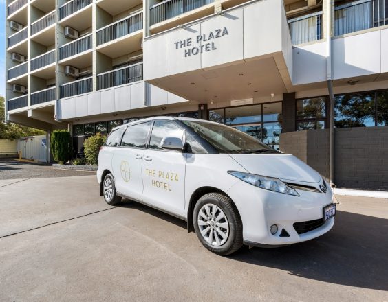 Plaza Hotel from the front, car with Plaza logo on it