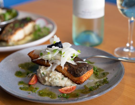 Salmon meal at the Kalgoorlie Plaza, on plate with wine glass